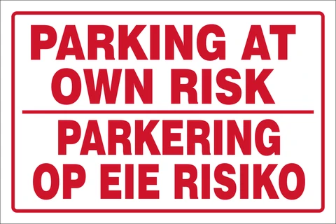 Parking at own risk safety sign